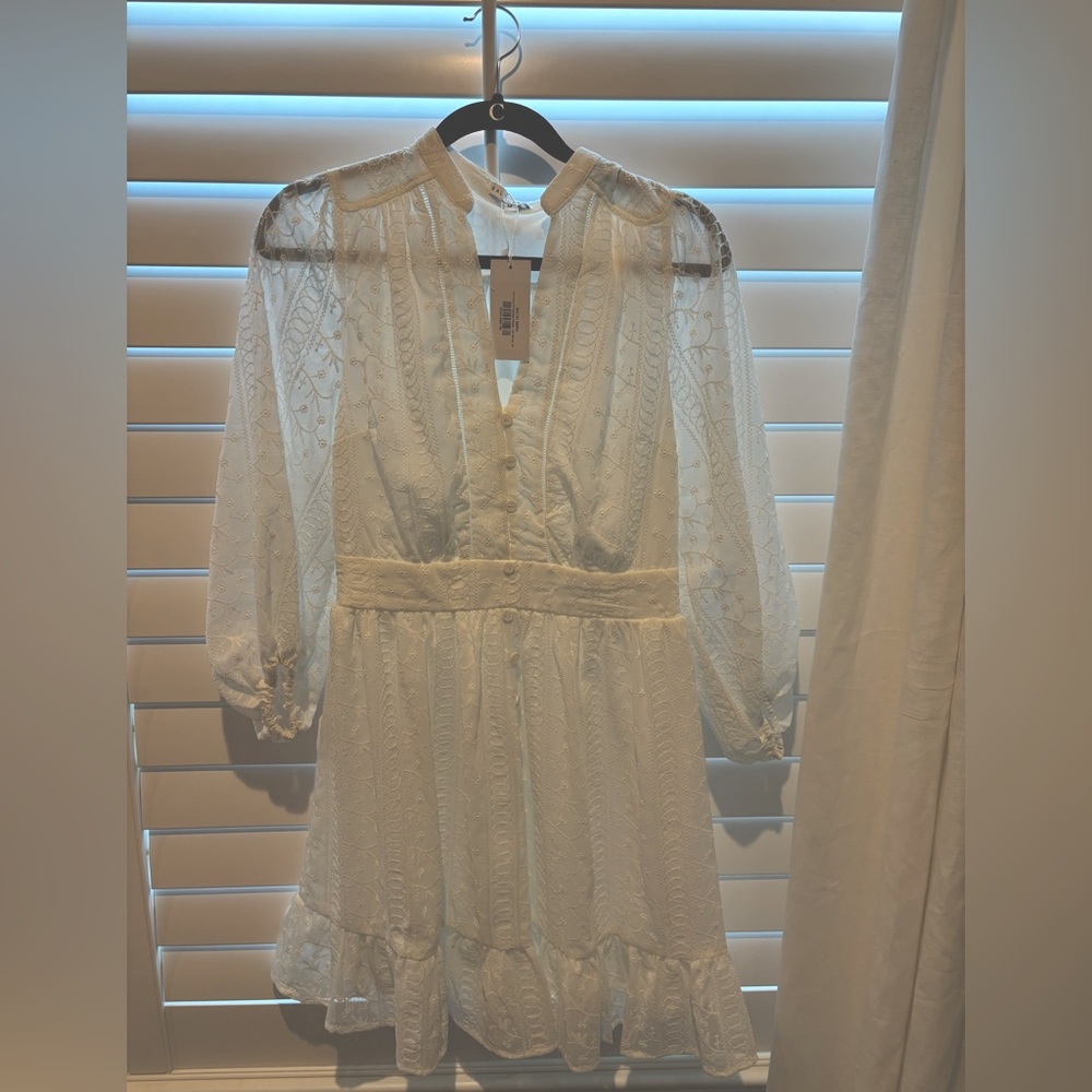 Baltic Born white  Babydoll Dress with Plunge Neckline and Bishop Sleeves